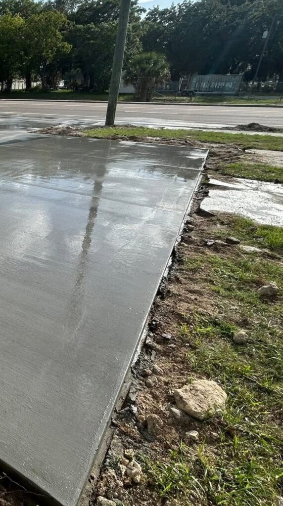 Freshly finished, wet concrete slab shining after installation in Fayetteville, NC