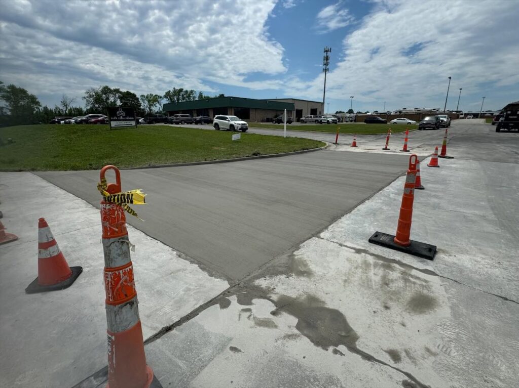 Wide concrete slab pour marked with safety cones in Fayetteville, NC