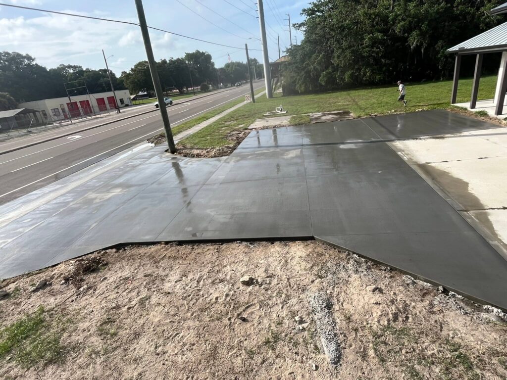 Freshly poured residential concrete driveway on a Fayetteville, NC street